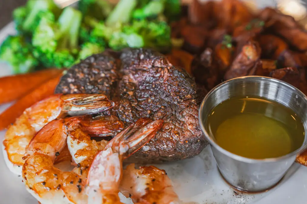 Surf and turf by the 8th Street at the Ivy featuring steak, shrimp and a side of potatoes and broccoli