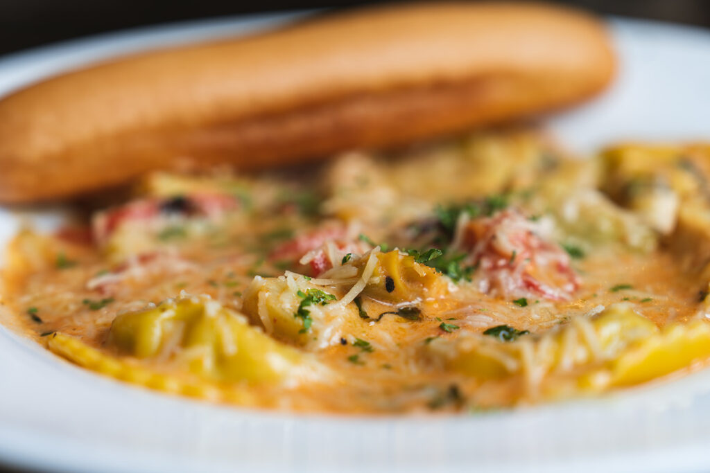Ravioli Florentine with a side of bread by the the 8th Street at the Ivy