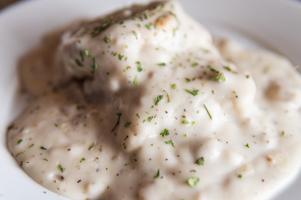 Biscuits covered with gravy by the 8th Street at the Ivy