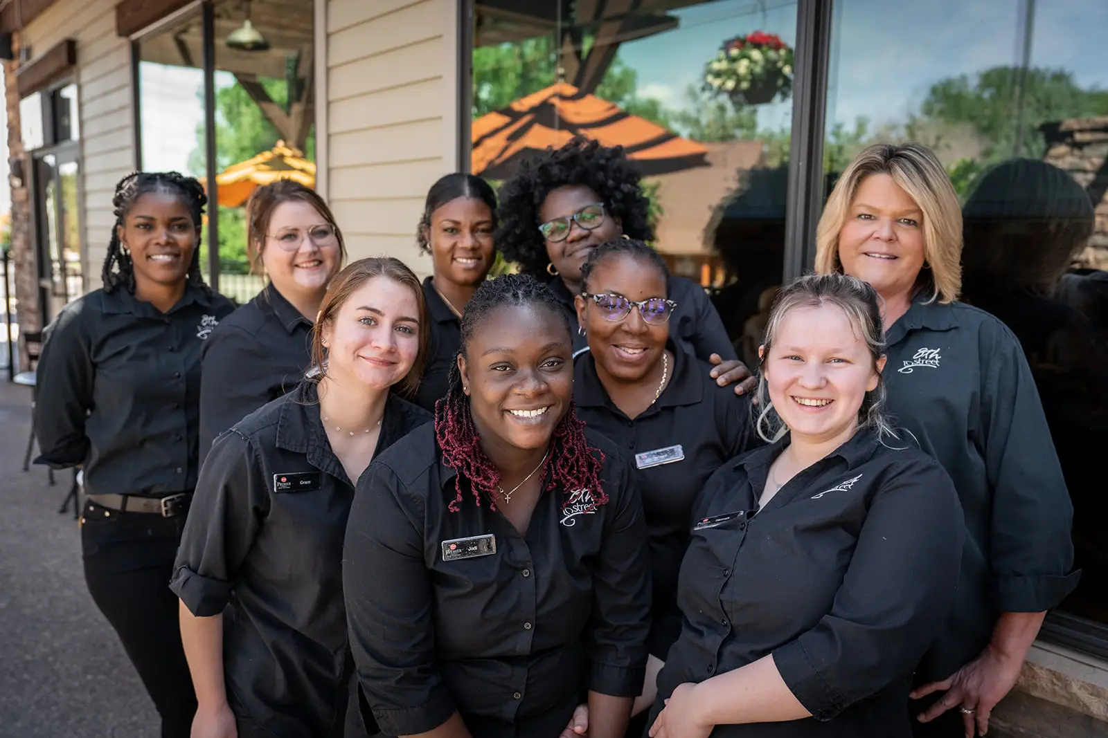 Group photo of the team members at 8th Street at the Ivy